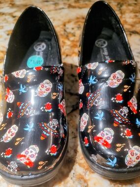 Easy Street Black Sugar Skull Print Clogs with Red & Blue Accents